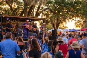 Cajun zydeco music performance at outdoor Louisiana festival celebrating Acadian heritage near Broussard.